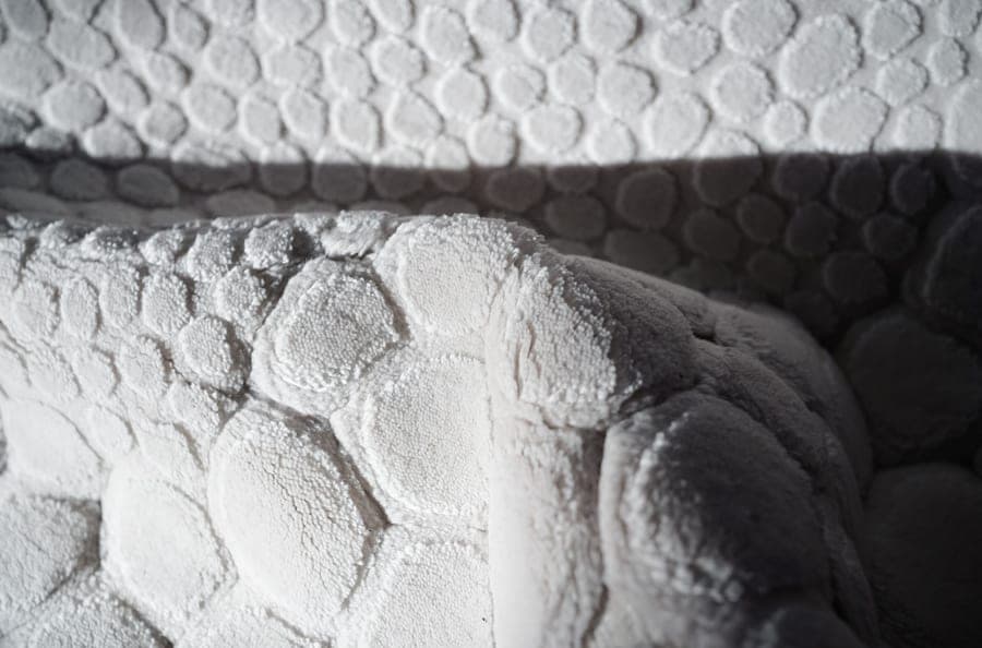 Close-up of a thick plush white bath sheet surface