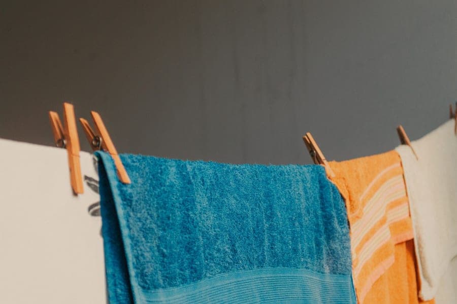 Washing soda box on a laundry shelf with towels