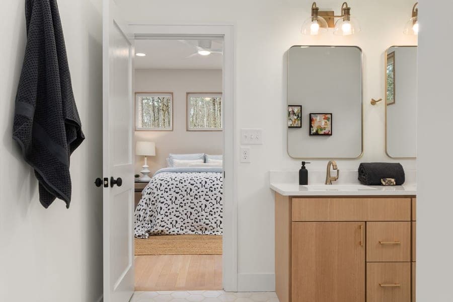 Patterned cotton bathroom rug beside a vanity
