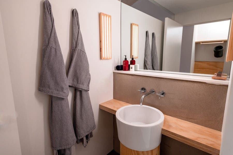 Lightweight waffle weave cotton robe hanging in a bathroom