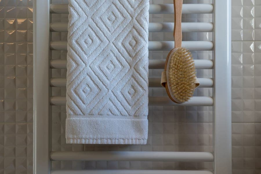 Soft zero-twist cotton bath towel draped over a rail