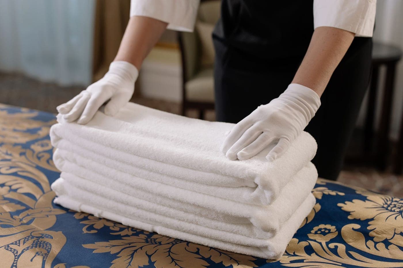 A stack of folded white cotton washcloths