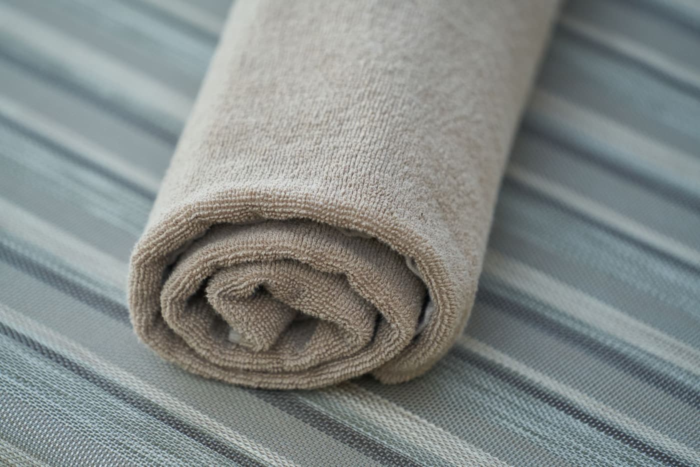 Two cotton towels of different weights placed side by side