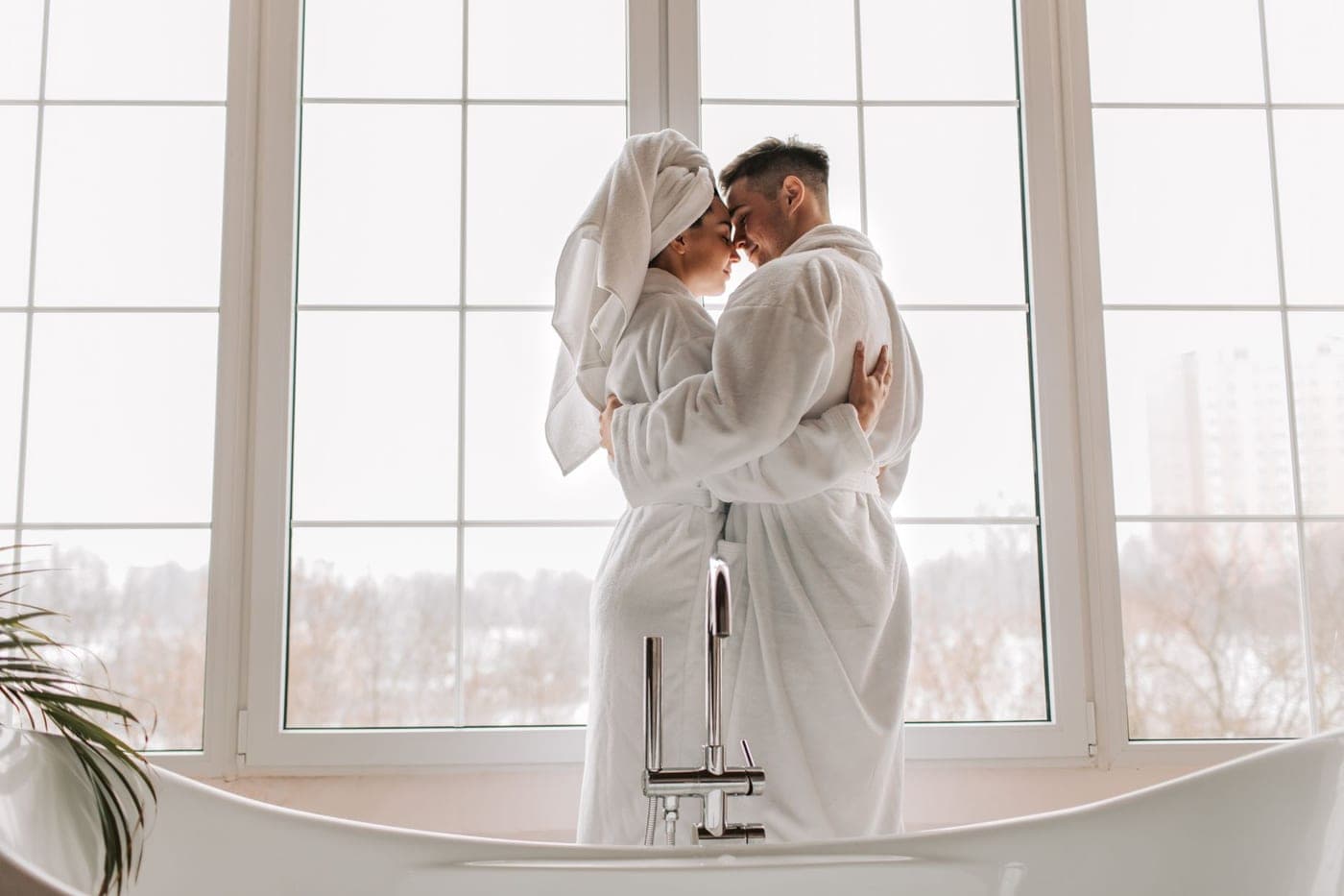 A waffle robe and a terry robe hanging side by side